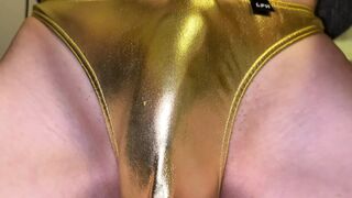 Jizz in gold shiny thong close up
