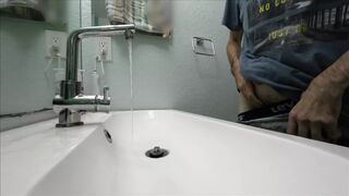 Amatuer stud jerking off his uncut big schlong and make cums on at motel bathroom home made tape
